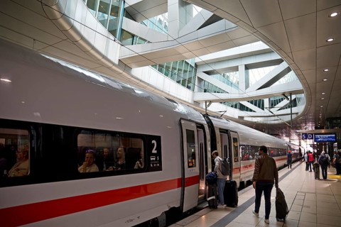ICE at the centre platform with the large opening to the glass dome, long-distance train station,