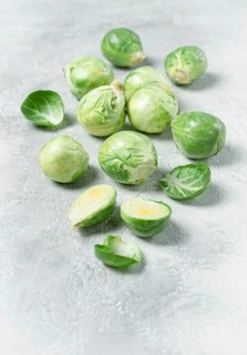 Fresh Brussels sprouts, raw, top view, on a gray table, no people