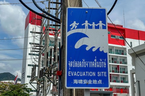 Tsunami Hazard Zone. Warning sign, signposting of escape routes in the event of another seaquake.
