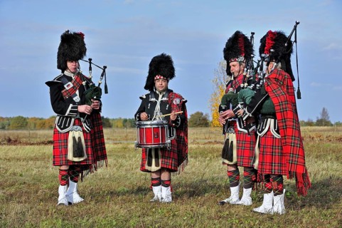 Scottish bagpipers playing pipes and drums, Scotland, UK