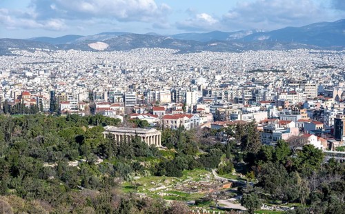 View over the sea of houses of Athens, in front Greek Agora with Hephaistos Temple, Athens, Attica,