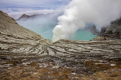 Sulfuric lake of Kawah Ijen Mountain's cauldron in the Banyuwangi Regency of East Java, Indonesia,