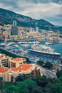 View of Monte Carlo, Monaco with race track street circuit and port with yachts and boats