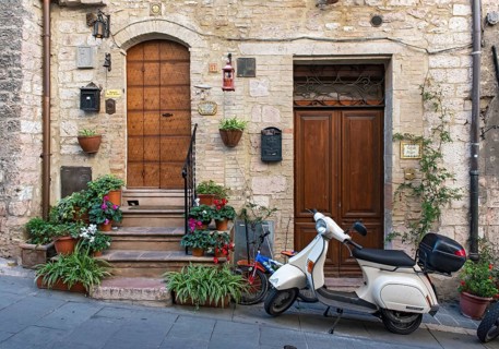 Vespa scooter in the streets of Assisi Old Town, Umbria, Italy, Europe