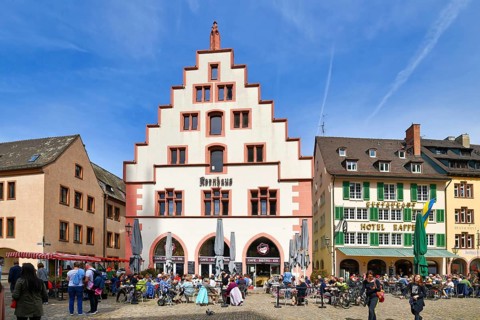 Freiburg, Germany, April 2022: Hirstoric building called 'Kornhaus' at munster town square with