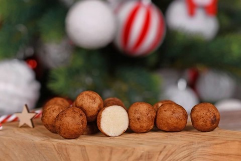 Traditional German Christmas sweets called 'Marzipankartoffeln'. Round ball shaped almond paste