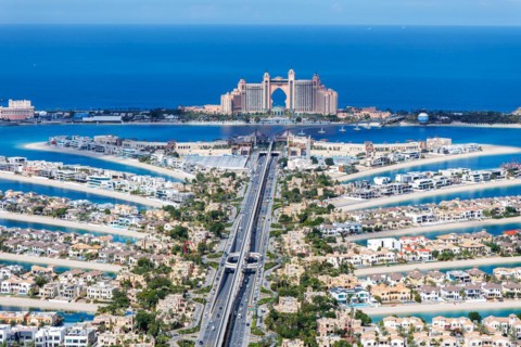 The Palm Jumeirah with Atlantis Hotel artificial island from above in Dubai, United Arab Emirates,