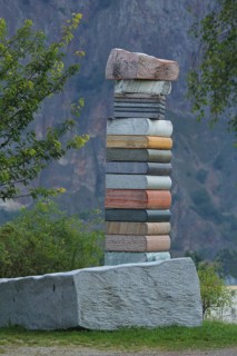 Sculpture stack of books made of stone, stack, books stacked, high, on top of each other, stone