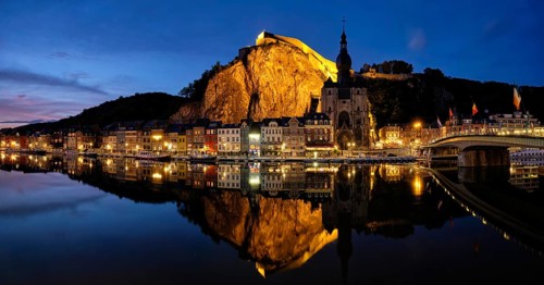 Night panorama of Dinant town, Collegiate Church of Notre Dame de Dinant over River Meuse and Pont