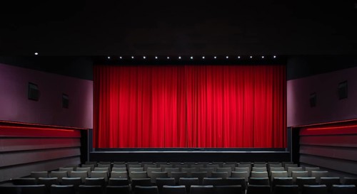 Interior shot, red velvet curtain in a cinema, theatre, rows of seats, Stuttgart,