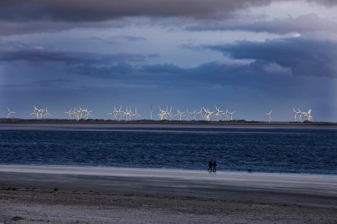 From the beach in Norderney many wind turbines can be seen in Norddeich, East Frisia, Lower Saxony,