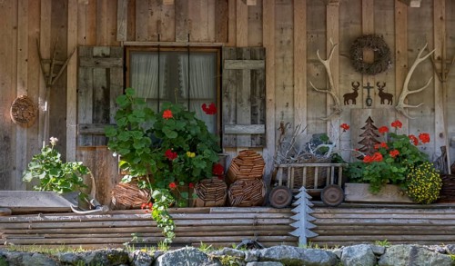 Wooden house with various decorations, Garmisch-Partenkirchen, Bavaria, Germany, Europe