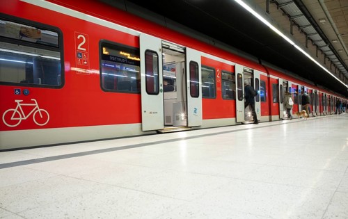 Travellers boarding S-Bahn, train, class 420 in traffic red, platform, stop, Feuersee station,