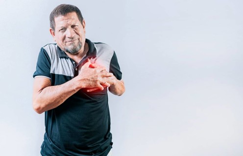 Senior man with tachycardia touching his chest. Elderly person with heart problems. Old man with