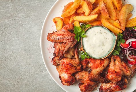 Fried chicken wings, with potatoes, and spices, homemade, fast food, no people