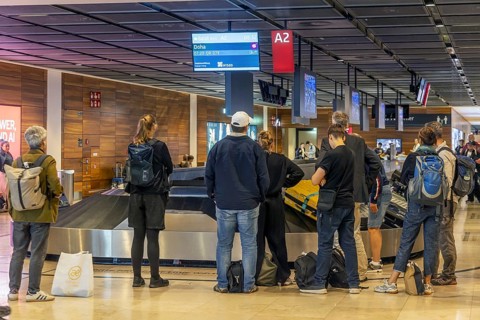 Berlin-Brandenburg BER Airport. Passengers waiting for their suitcases at baggage reclaim. Berlin,