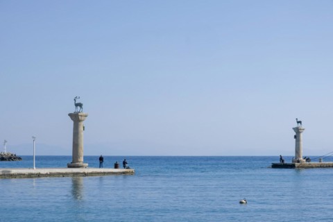 Elafos and Elafina, stag and hind, sculptures on columns, harbour entrance Mandraki harbour,