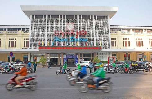 Moped rider at Hanoi railway station, Vietnam, Asia
