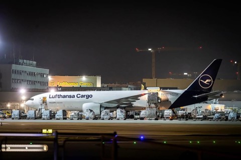 Lufthansa Cargo aircraft being loaded at the cargo centre, early in the morning at the airport in