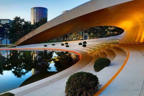 Illuminated Porsche Pavilion in the evening, Autostadt, Volkswagen AG, Wolfsburg, Lower Saxony,
