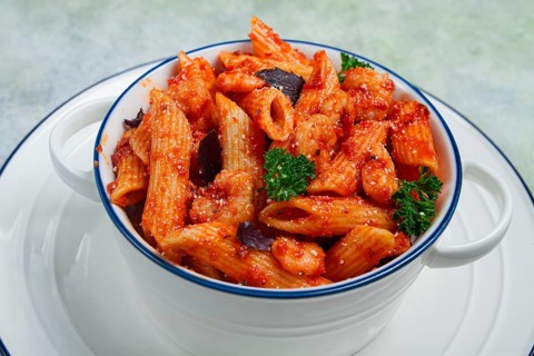 Penne pasta, with shrimp in tomato sauce, close-up, no people