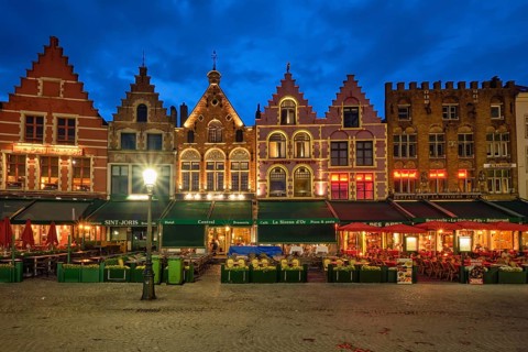 Bruges, Belgium, May 29, 2018: Bruges Grote markt square famous tourist place with many cafe and