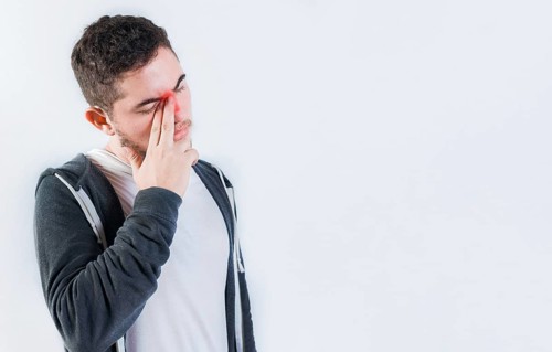 Man with nasal congestion isolated. Person with sinusitis and nasal inflammation