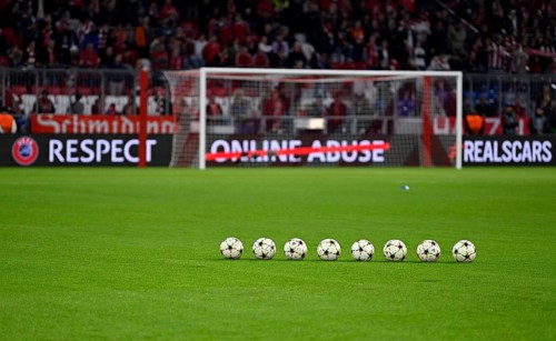 8 Adidas match balls with Champions League logo lie in front of goal, perimeter advertising RESPECT