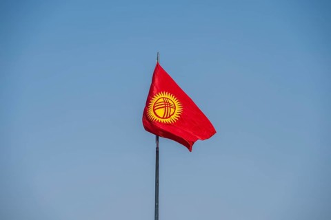 Kyrgyz flag in front of a blue sky, Bishkek, Kyrgyzstan, Asia