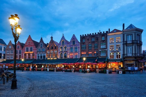 Bruges, Belgium, May 29, 2018: Bruges Grote markt square famous tourist place with many cafe and