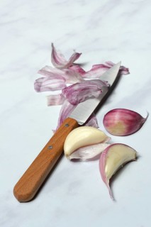 Fresh red garlic cloves with knife, France, Europe