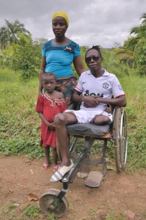 Amputee with his wife and child, Motema Amputee Camp, Koidu, Koidu-Sefadu, Kono District, Eastern