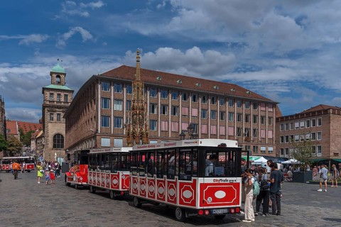 City Train tourist train at the Main Market Square, Old and New Town Halls and Schöner Brunnen,
