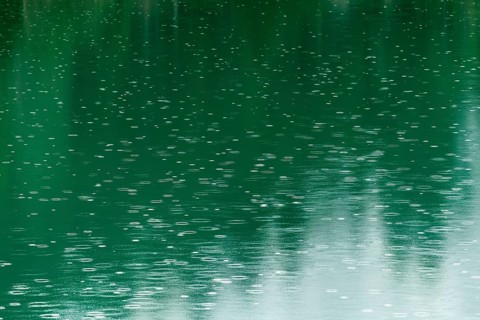 Raindrops on emerald green reservoir, Stillup reservoir, Stilluptal, Mayrhofen, High Mountain