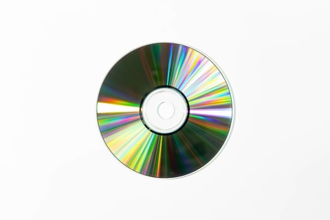 A single dazzling CD on a white background