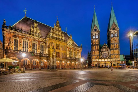 Market square, town hall square with town hall and cathedral in the historic city centre at dusk,