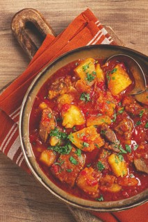 Potatoes with meat, stewed in tomato sauce, with spices and herbs, homemade, no people