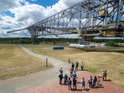 Visitor group below conveyer brigde F60 in Lichterfeld, now a museum left after coal mining. Two