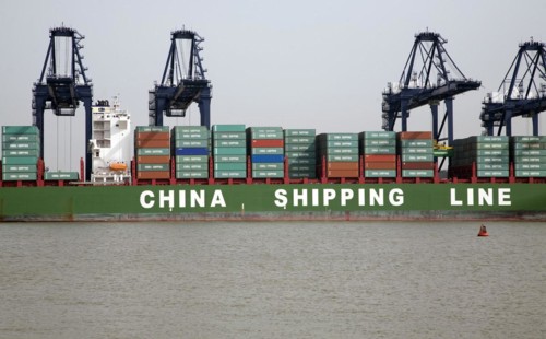 Cranes unloading containers China Shipping Line container ship, Port of Felixstowe, Suffolk,