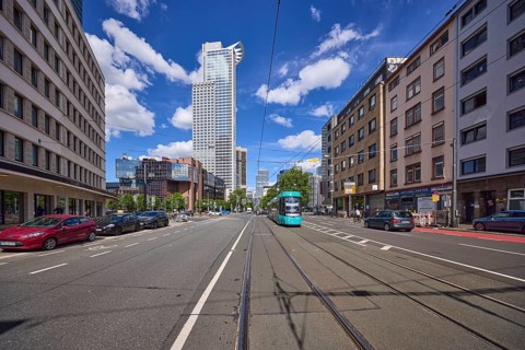 Kronenhochhaus or Westend 1, headquarters of DZ Bank, residential buildings and tram on Mainzer