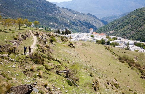 Walkers near the village of Capileira, High Alpujarras, Sierra Nevada, Granada province, Spain,