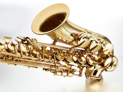 Saxophone in front of white background, detail, studio shot