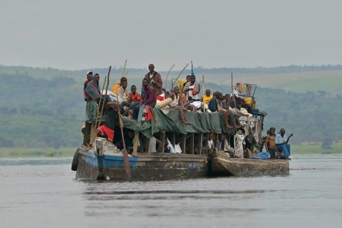 Overloaded boat on the Congo River, near Tshumbiri, Bandundu Province, Congo, Africa