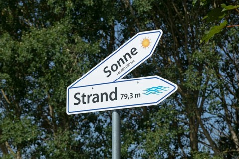 Signpost to the sun and the beach, Göhren, Rügen Island, Mecklenburg-Western Pomerania, Germany,