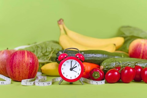 Diet concept for loosing weight with only eating healthy food at certain times with vegetables,