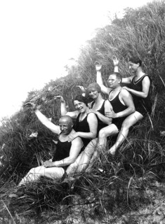 Bathing group, five sat in the dunes and raise their hands, funny, laughing, summer holidays,