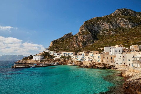 Levanzo village, hills, white houses, green sea, Levanzo, Egadi Islands, Sicily, Italy, Europe