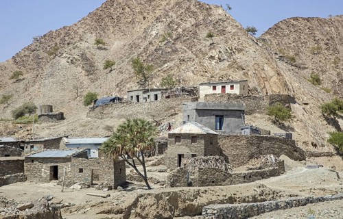 Little village with stone houses on the way to the Danakil Depression in the north of the Afar