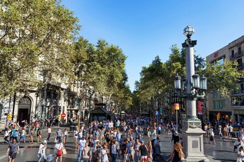 Crowd in summer, pedestrians and tourists in pedestrian zone La Rambla, Ramblas, old town,