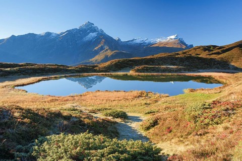 Piz Beverin and mountain lake, Grisons, Switzerland, Europe